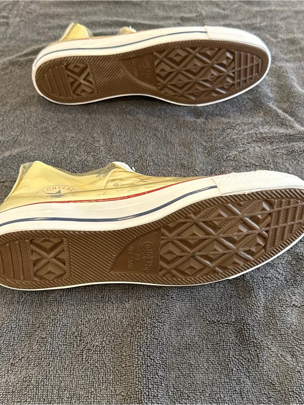 Converse white High Top Sneakers with vinyl zip cover.